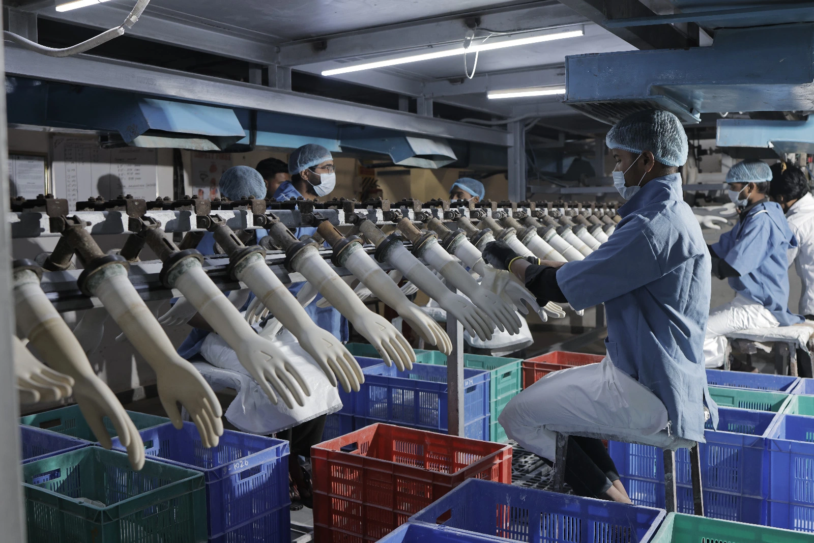 Surgeon in operation theatre wearing gloves